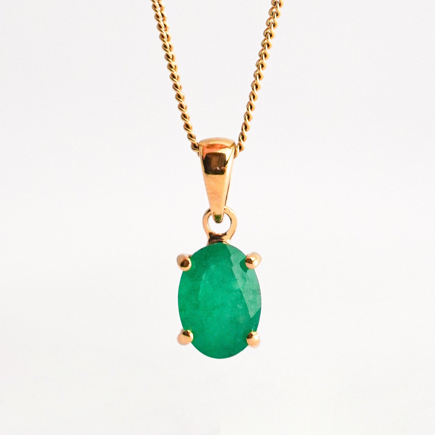 Oval Emerald Solitaire Pendant in 18K Gold