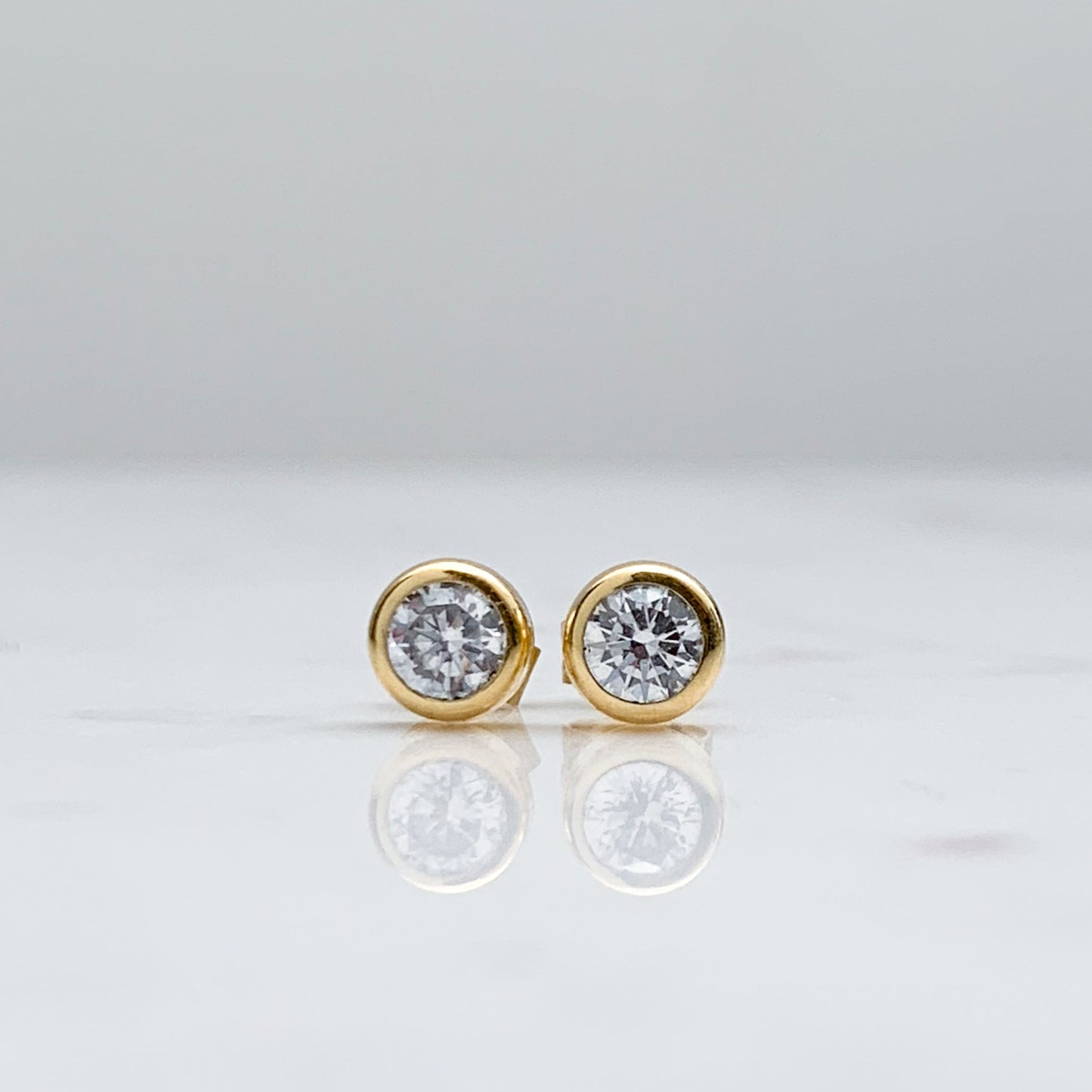 Bezel-Set Cubic Zirconia Stud Earrings in 18K Gold